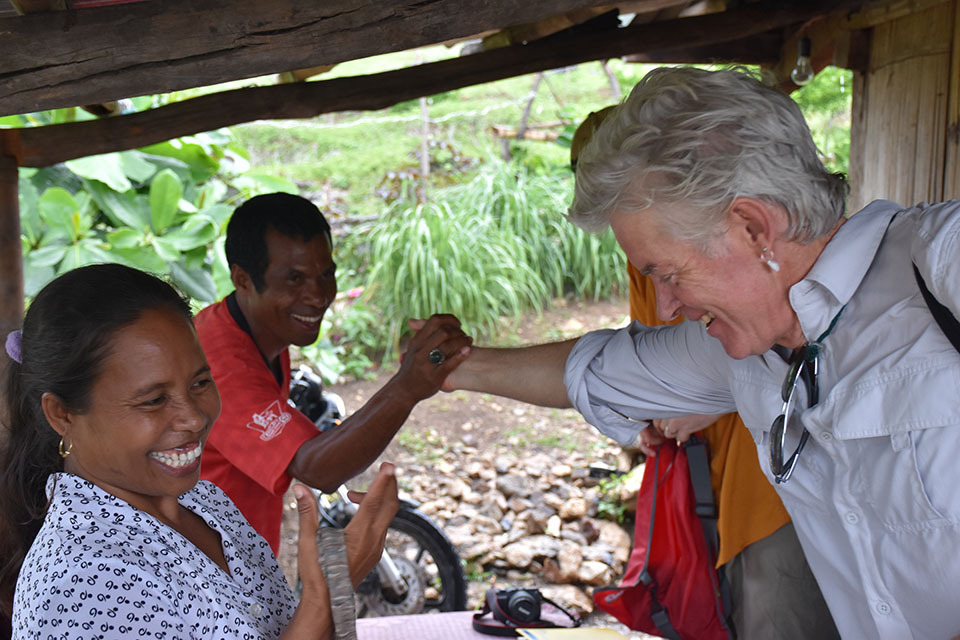 Andrew Mahar working with tree farmers